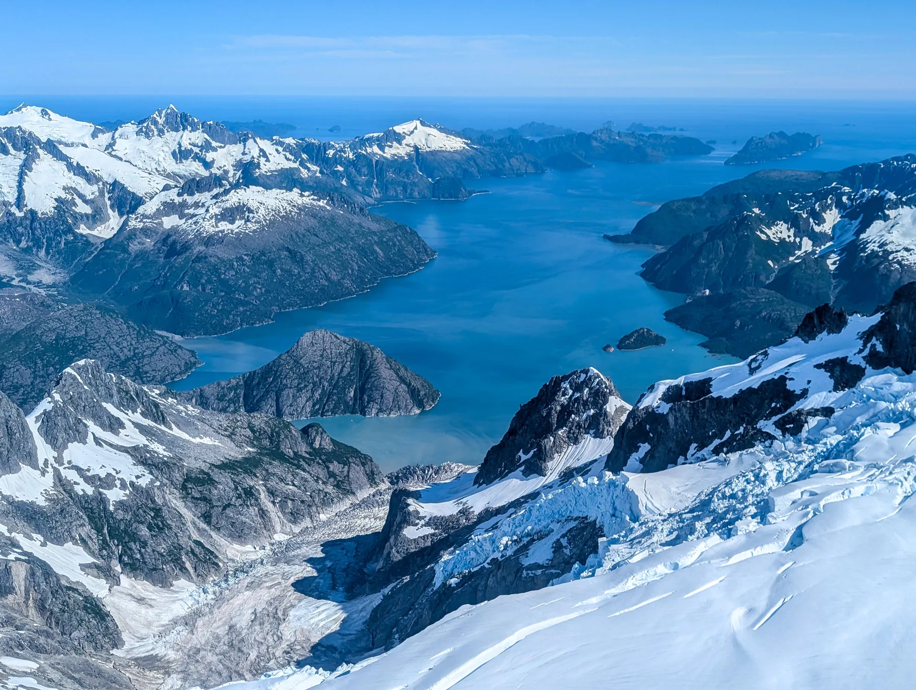 Snow covered mountains and blue fjords in Kenai Fjords National Park, Alaska